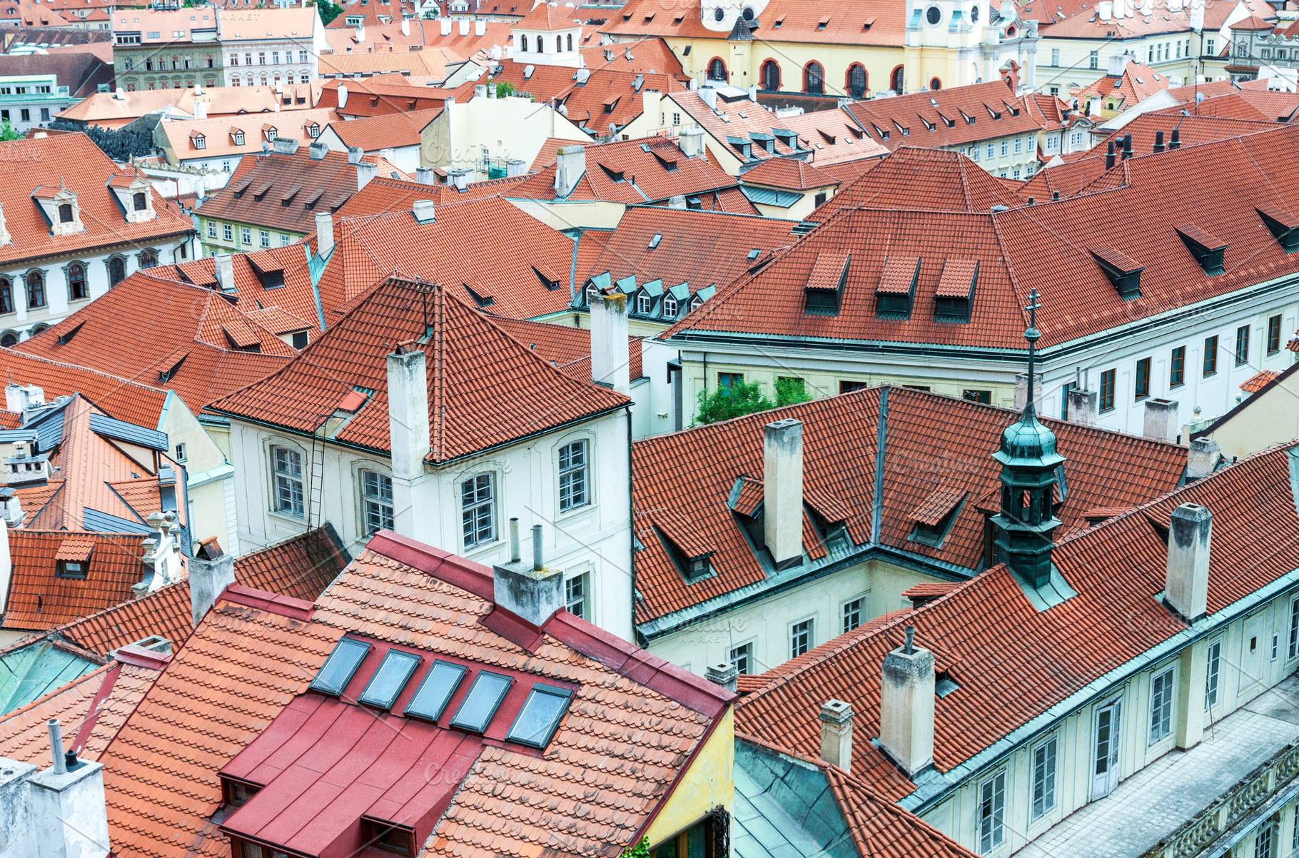 Red tiled roofs of Prague old town, an Architecture Photo by BOOCYS
