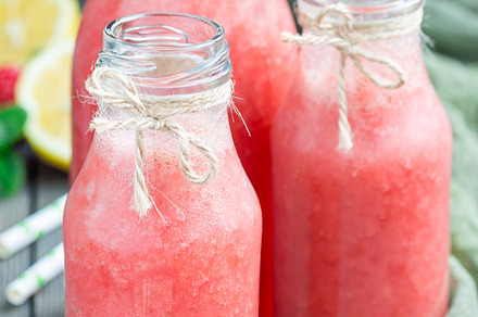 Homemade blended lemonade with fresh strawberry lemon ice and mint in glass, a Food & Drink Photo by iuliia_n