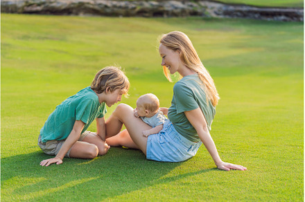 Mother, older son, and newborn baby