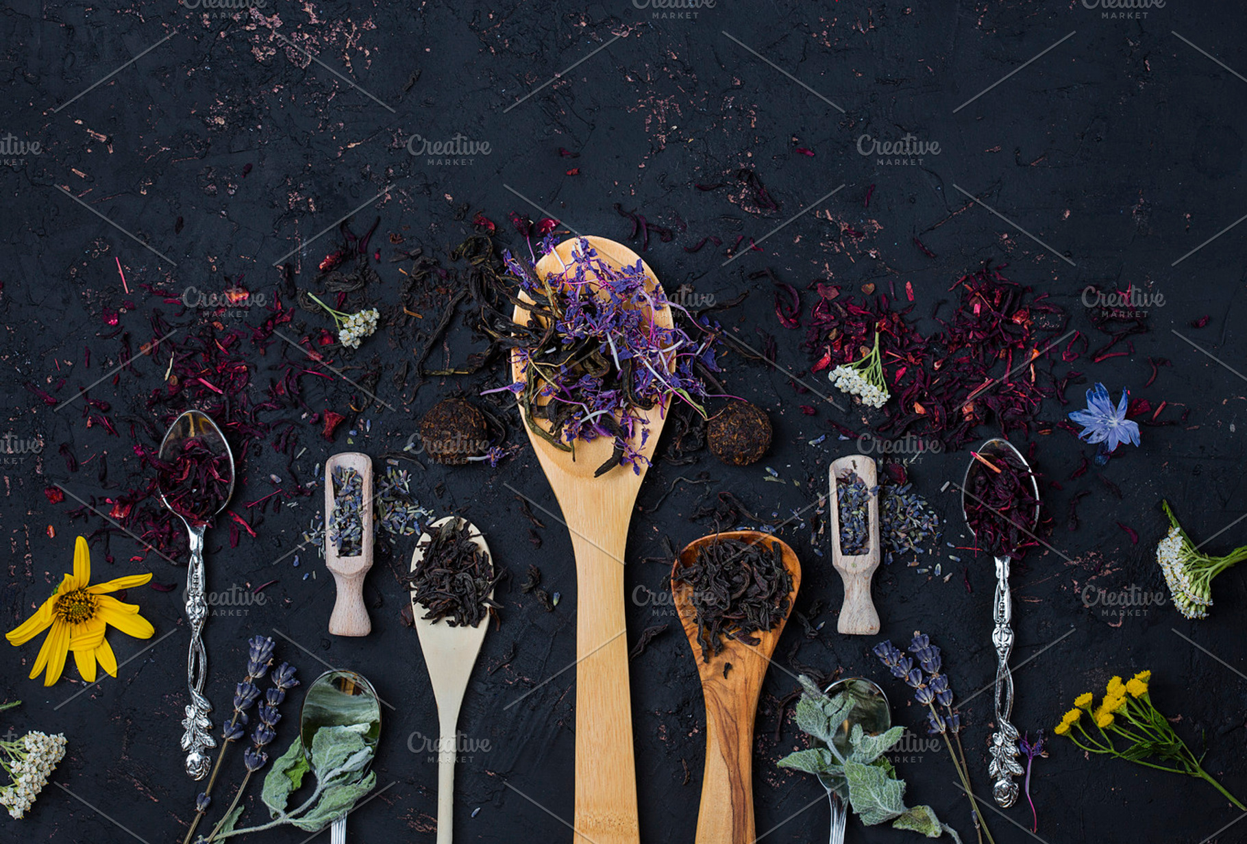 Different types of tea presented in the wooden and silver spoons stock photo, a Food & Drink Photo by Marina_Pronina