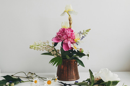 Stylish peony, lupin, iris and daisy composition and scissors on, a Nature Photo by Sonjachni