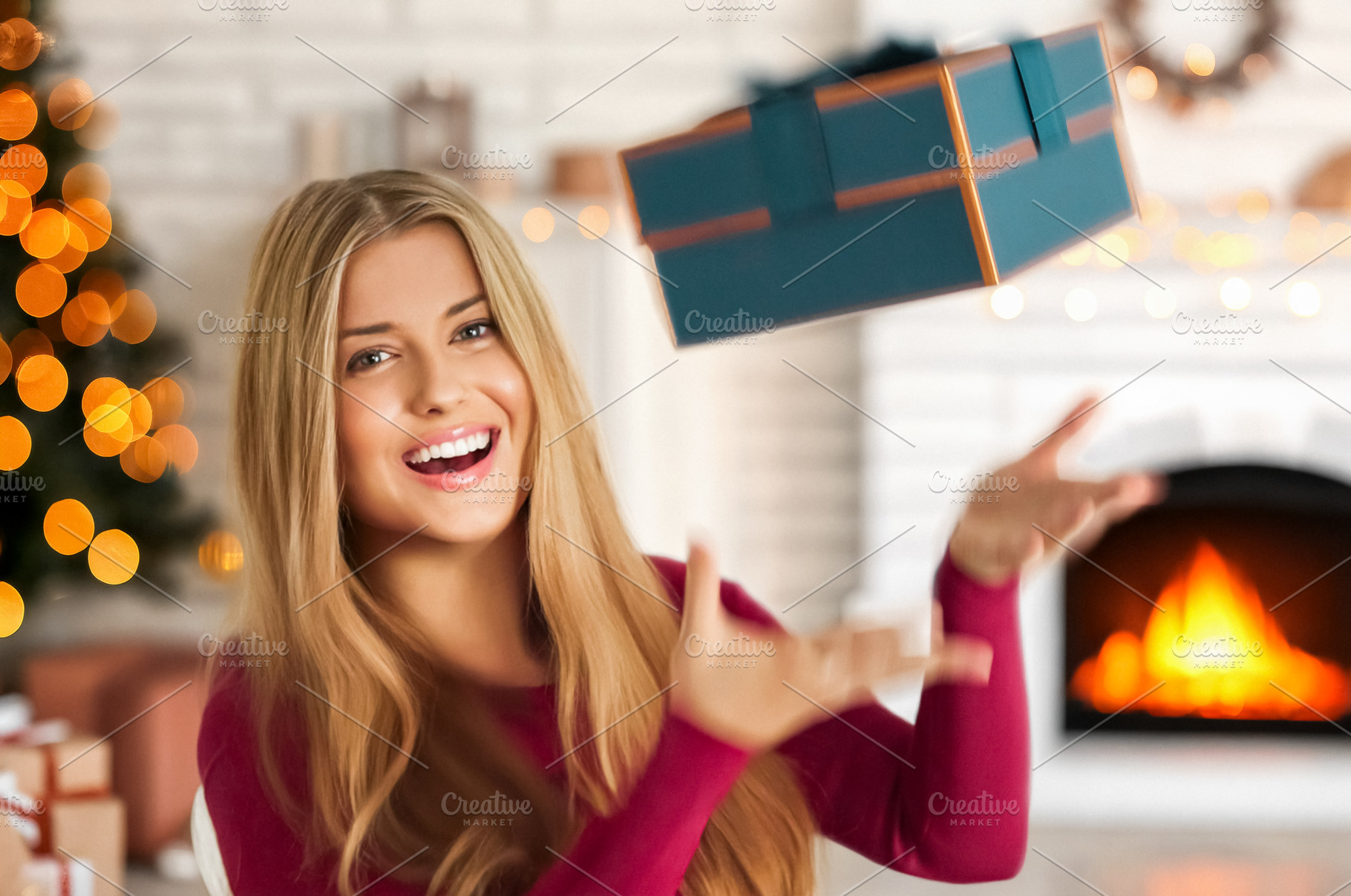 Happy woman catching a Christmas gift, celebrating winter holida, a Person Photo by Studio ANNA