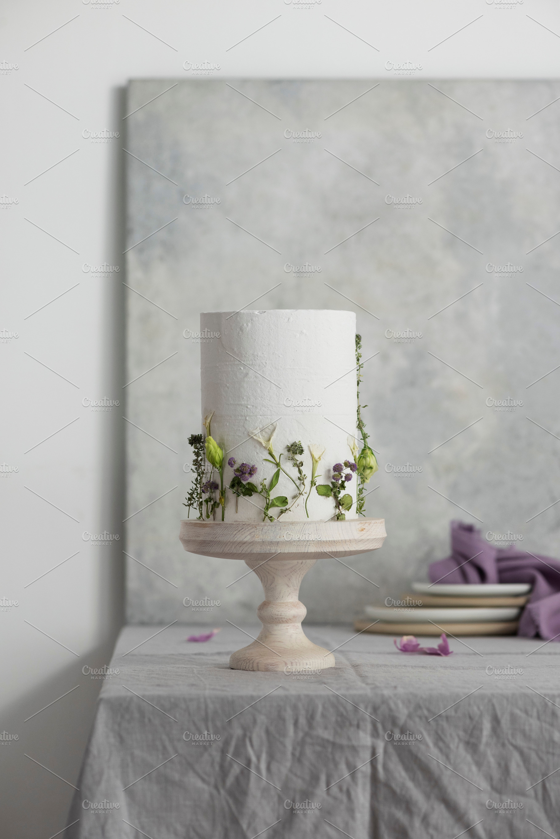 White wedding cake with lillac and green flowers, a Food & Drink Photo by oxana.denezhkina