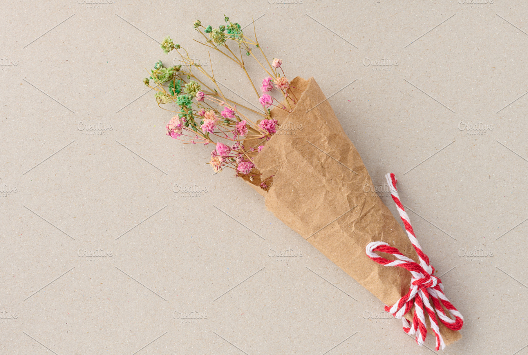 A small bouquet of multi-colored dried gypsophila flowers, wrapp, an Abstract Photo by ndanko