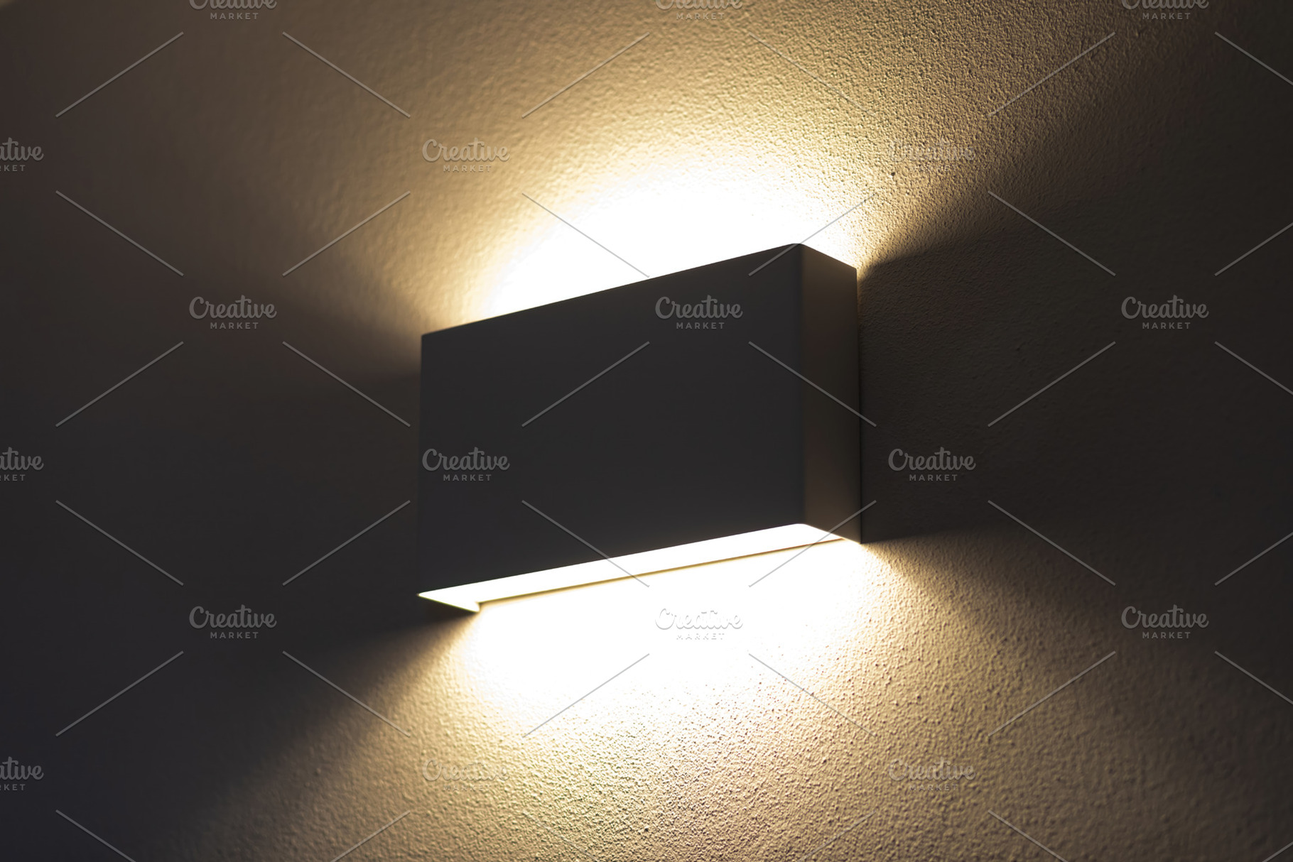 Modern wall lamp illuminating a textured wall in a dark room, an Architecture Photo by Antonio Gravante Market