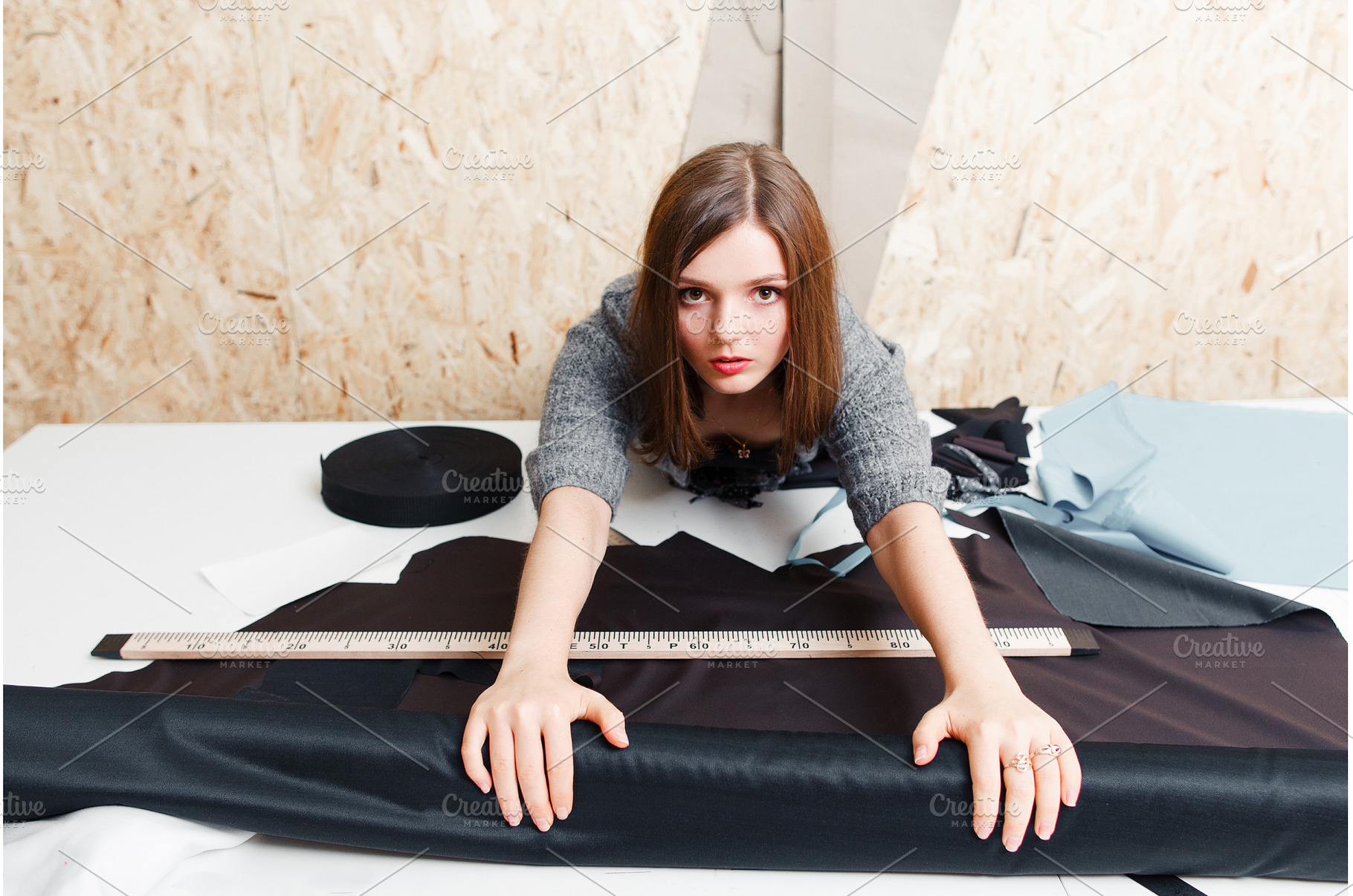 Female tailor taking fabric for, a Beauty & Fashion Photo by Photo Drive Studio