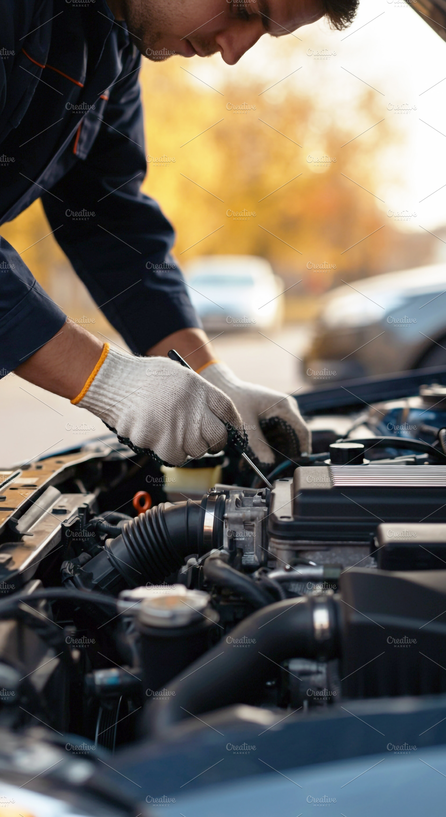 Car Mechanic Repairing Vehicle Engin, a Transportation Photo by Stock Shape