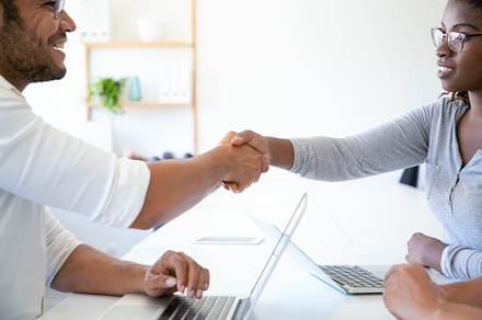 Employee talking and shaking hands