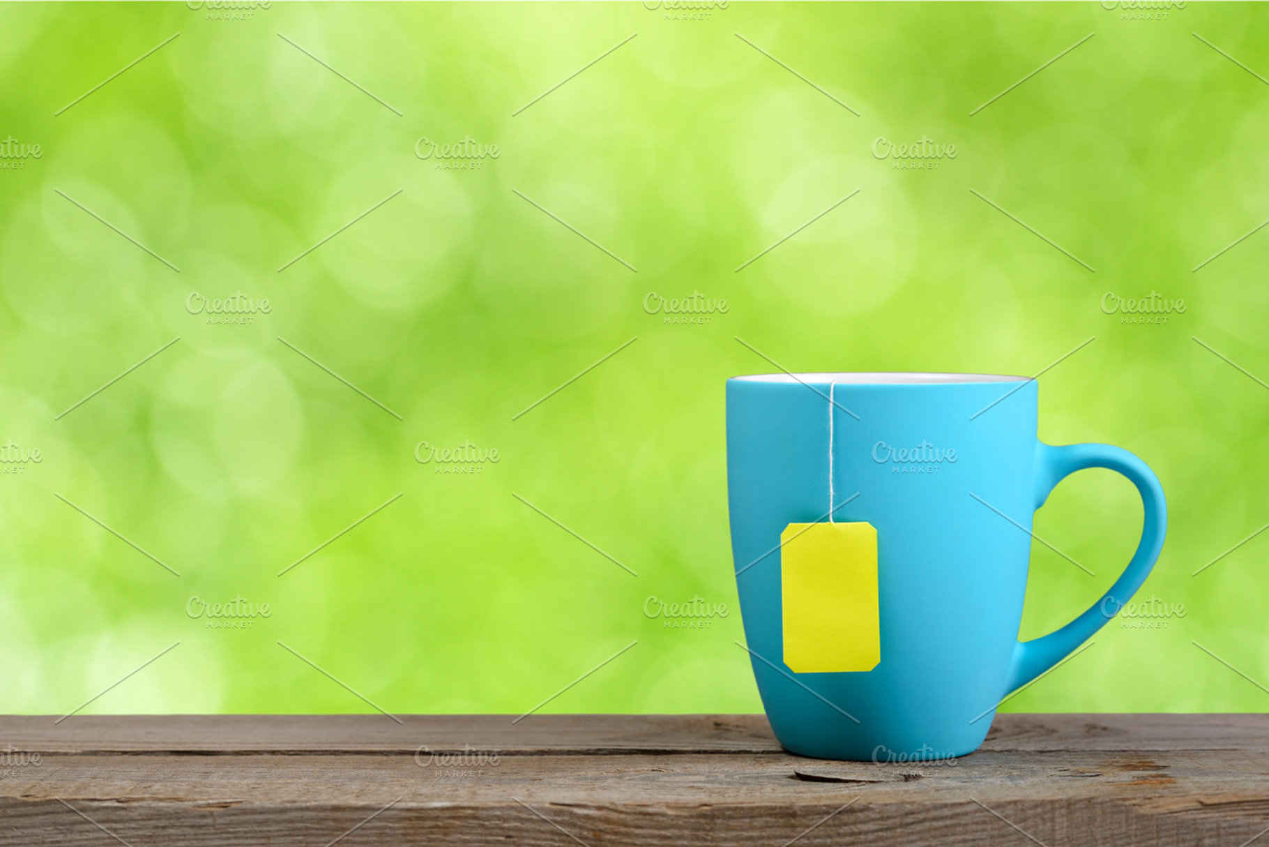 Cup of tea containing cup, tea, and mug