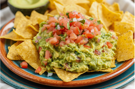 Guacamole dip with tortilla chips on, a Food & Drink Photo by Lermont51