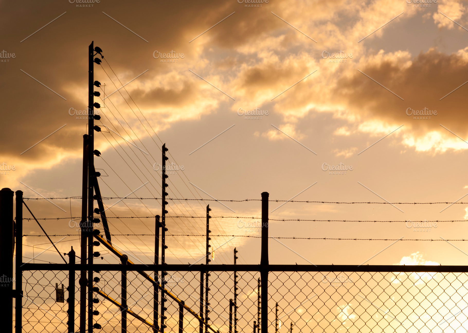 Sunset Fence, an Industrial Photo by THP Creative