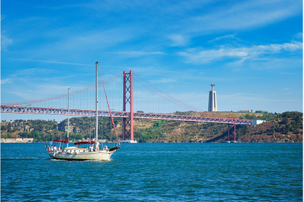 View of 25 de Abril Bridge over, a Transportation Photo by f9photos