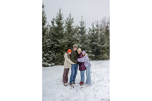 Family sharing a group hug during, a Sports & Recreation Photo by HalfPoint
