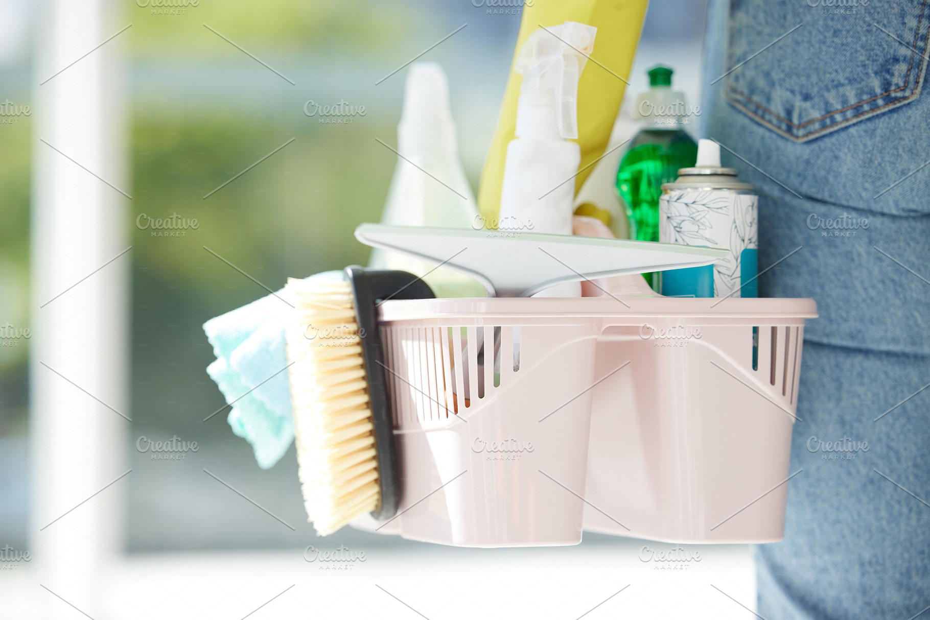 Home, cleaning and chemical products in a bucket for home care work and spring clean routine. Macro of cleaner with detergent spray, bottles and tools to scrub the interior of household., a Photo by Peopleimages.com