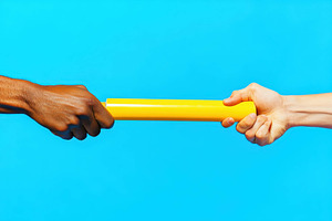 Different hands exchanging a baton a, a Photo by Tanuart