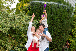 Family watches boy on father’s shoul, a Person Photo by Elena Vagengeim