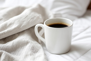 Warm cup of black coffee resting on, a Food & Drink Photo by MistyDay