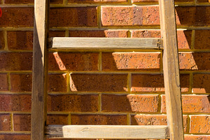 Vintage Wooden Ladder On Bricks, an Abstract Photo by THP Creative