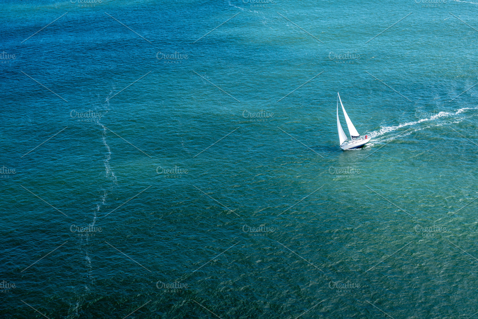 Sailboat gliding through the bay near Golden Gate Bridge, San Fr, a Transportation Photo by GoodGoods