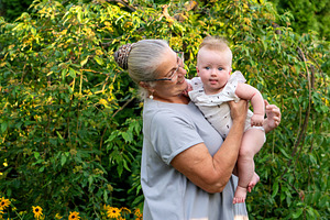 Grandmother holding smiling baby, a Person Photo by Elena Vagengeim