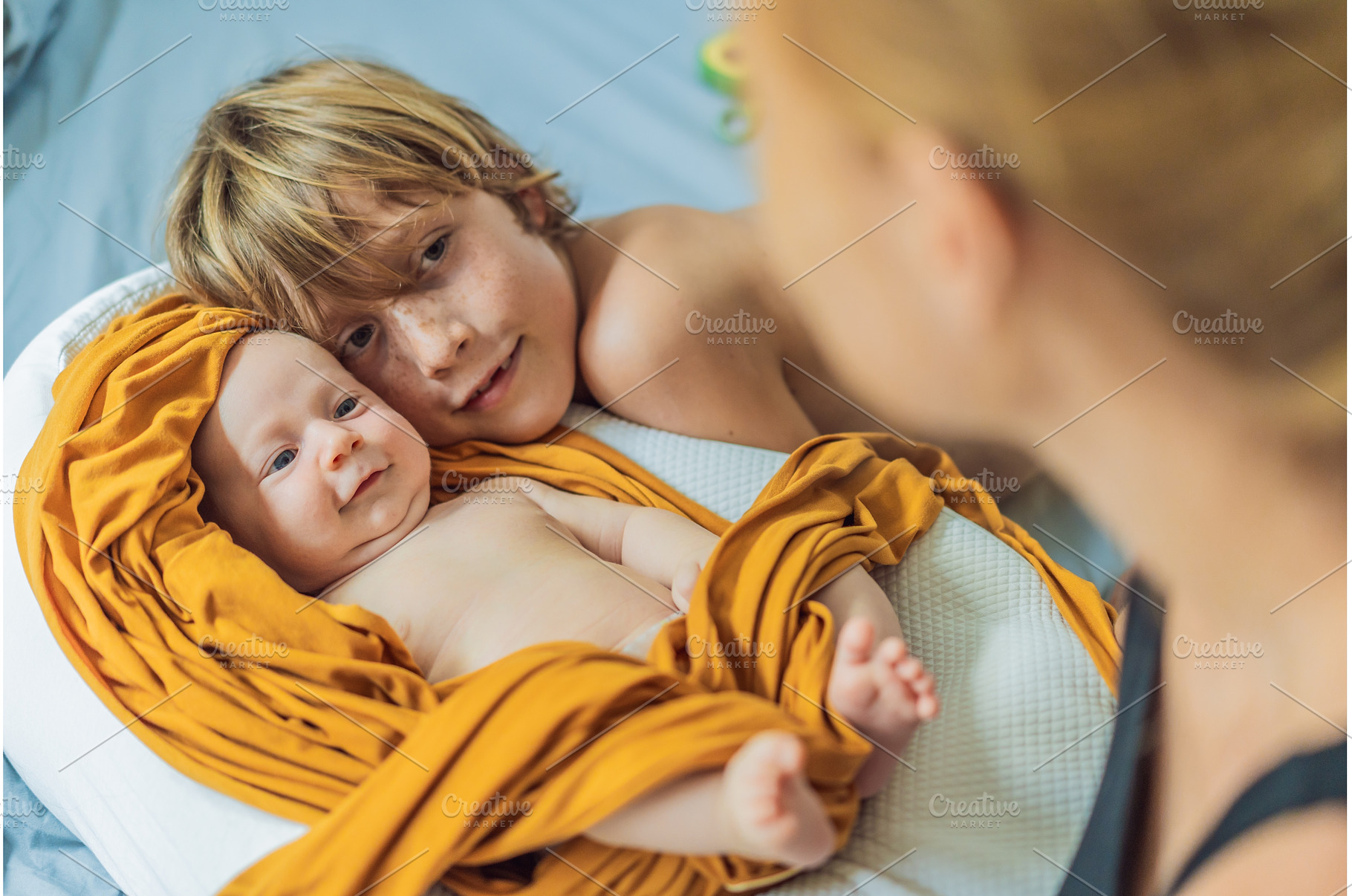 Older brother hugging his newborn, a Person Photo by Elizaveta Galitskaya