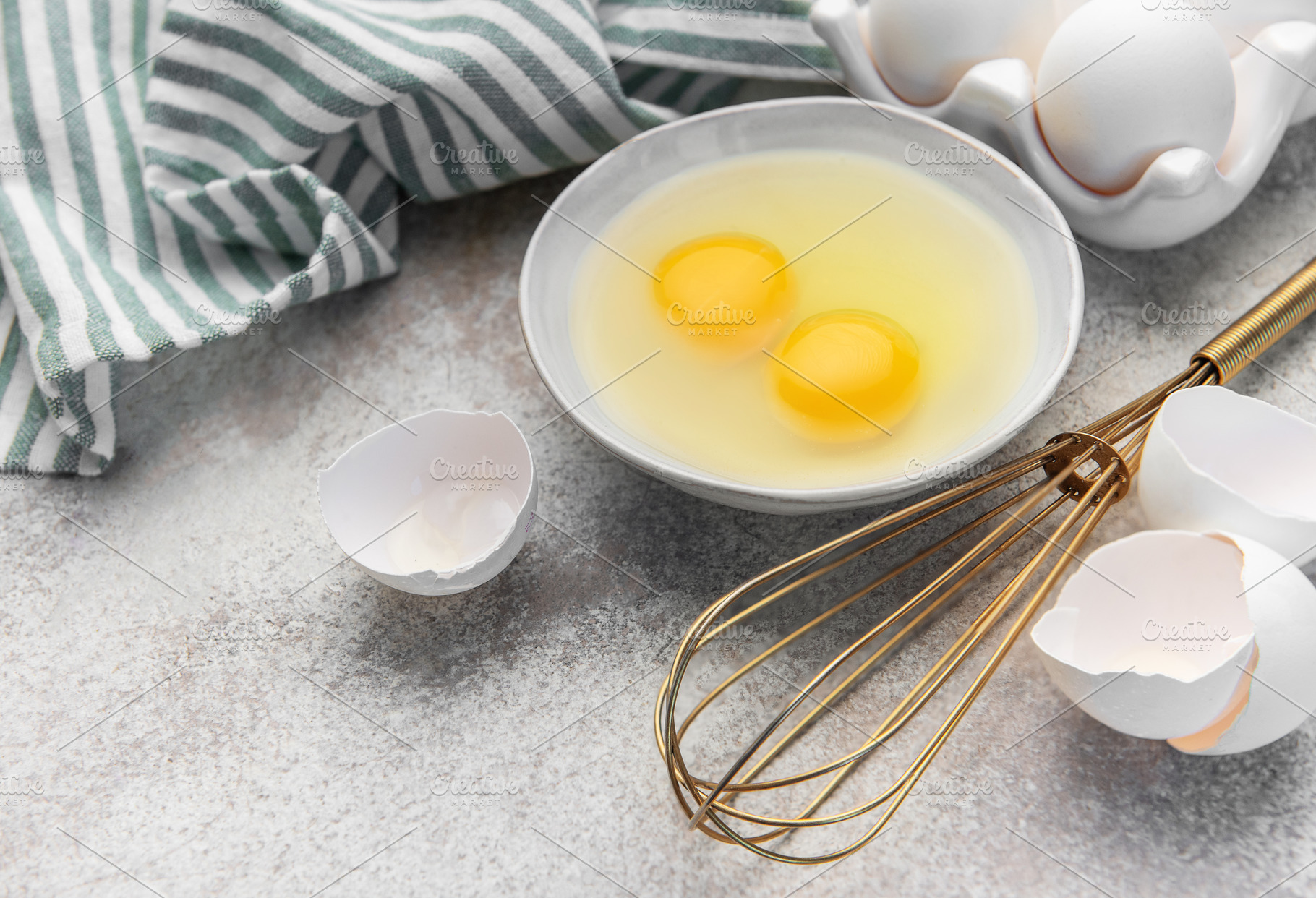 Preparing raw eggs for baking or a healthy breakfast, a Food & Drink Photo by Olena Rudo