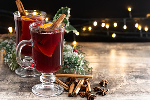 Mulled Wine with Orange and Cinnamon Sticks and Christmas decoration, a Food & Drink Photo by etorres69