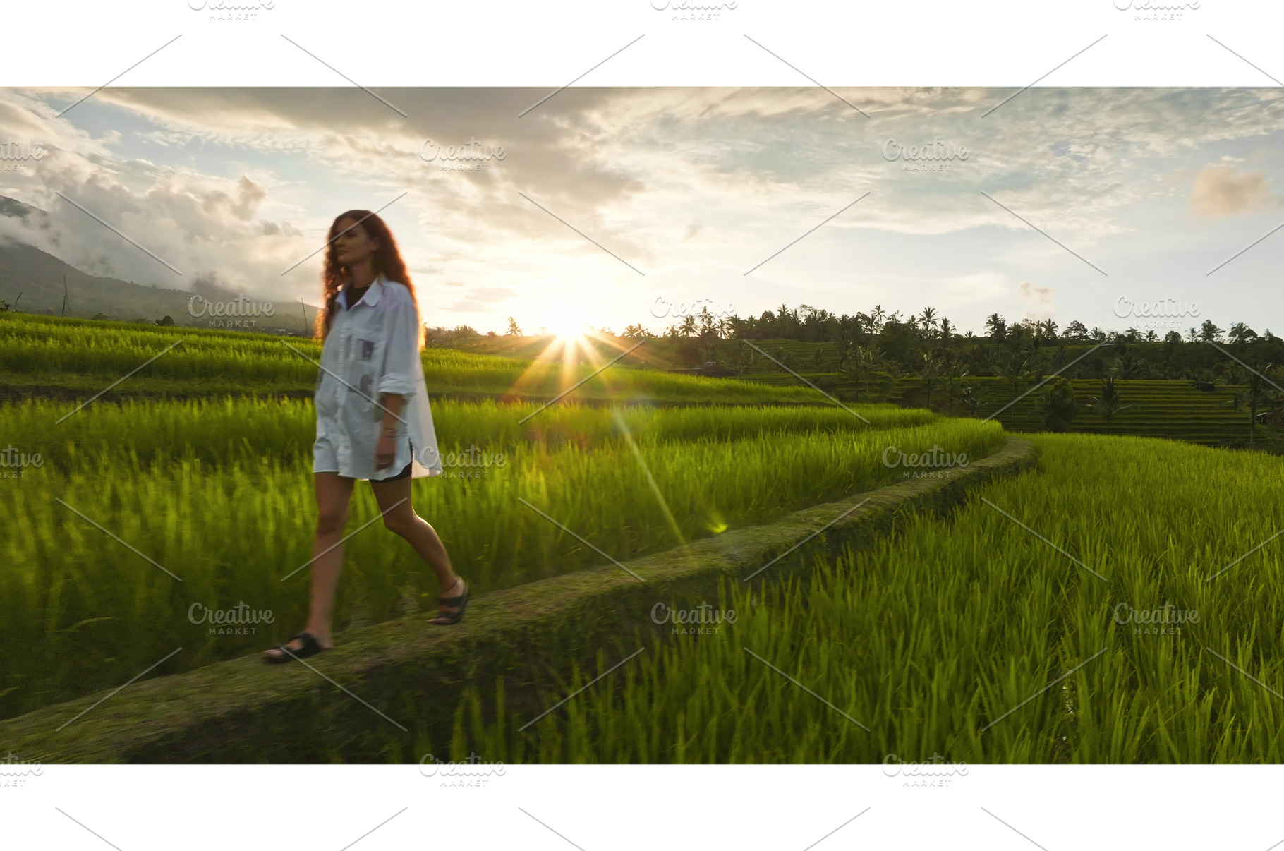 Woman walking through green Ubud, a Person Photo by Goinyk