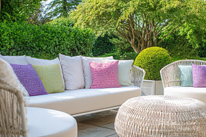 Outdoor patio furniture set on a sunny garden terrace inviting r, a Photo by Studio ANNA