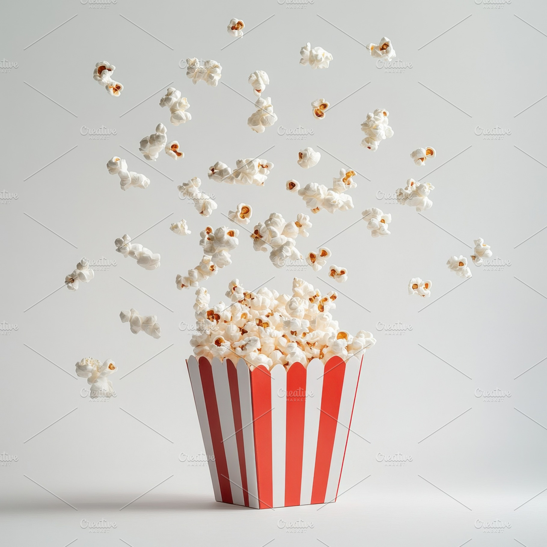 Popcorn flying with red white stripe, a Food & Drink Photo by Pixeness Studio