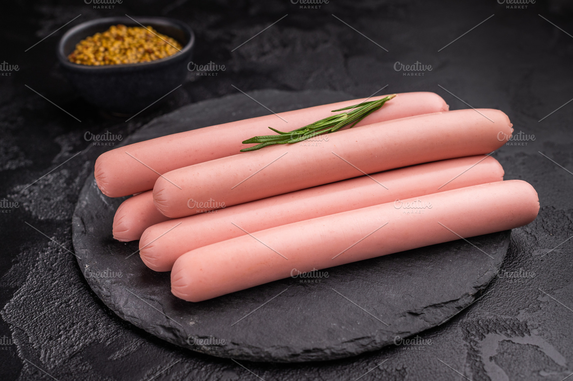 Raw hot dog sausages (frankfurters/wieners) on a dark stone back, a Food & Drink Photo by composter-box@mail.ru