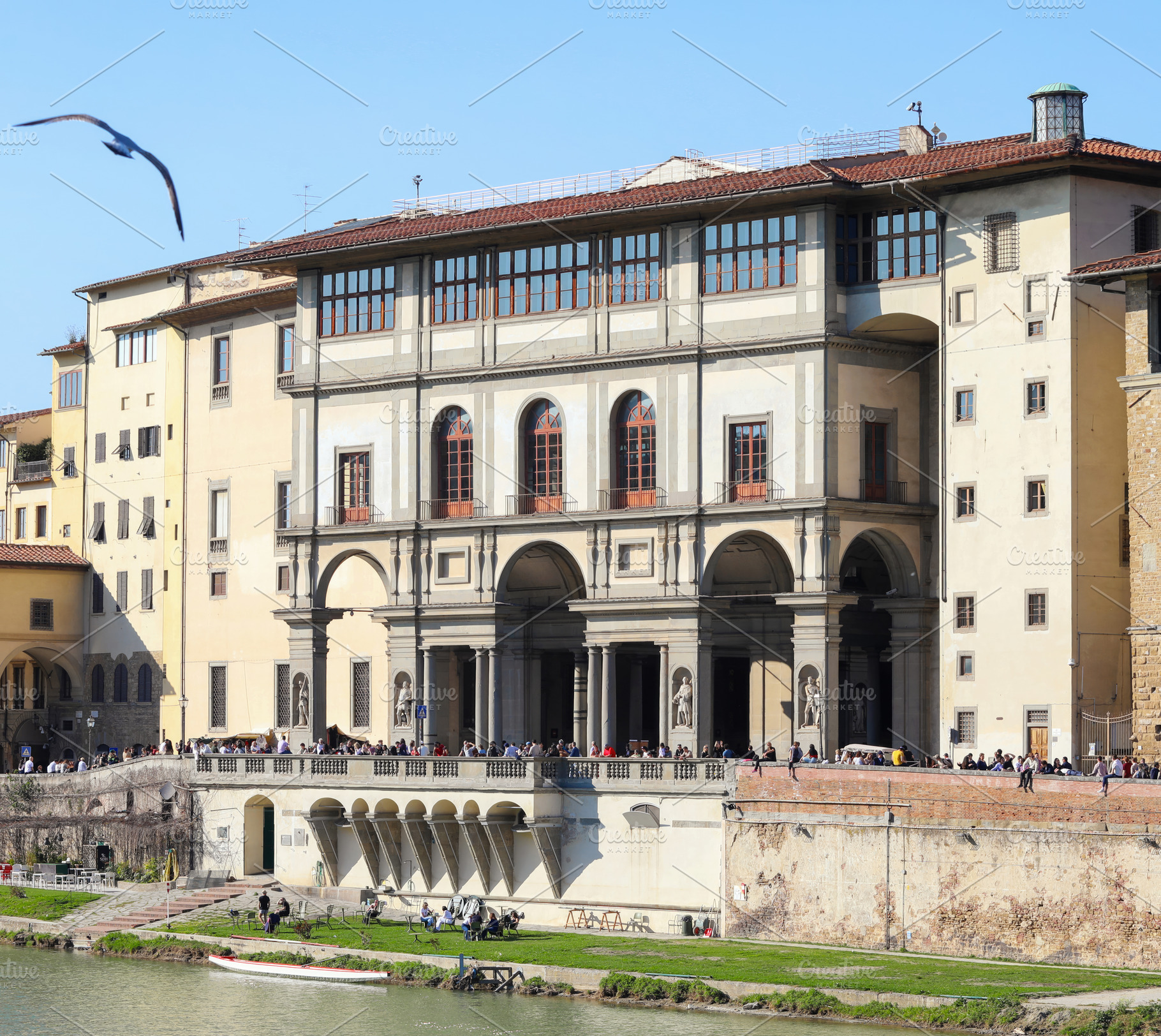 Uffizi Gallery in Florence with tourists enjoying sunny day, an Architecture Photo by Antonio Gravante Market