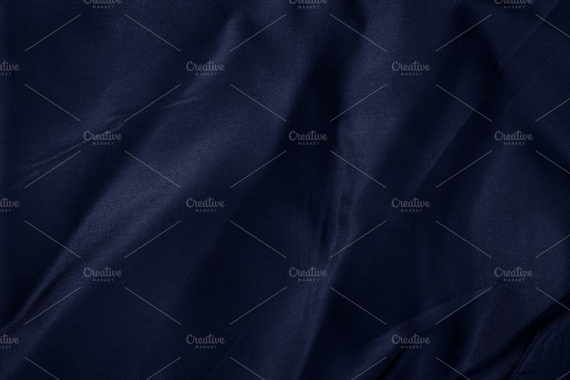Close-up of crumpled dark blue textile with soft folds, ideal fo, a Background Photo by Ales Munt