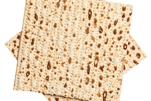 Two sheets of matzah stacked on top of each other, isolated on b, a Food & Drink Photo by ndanko