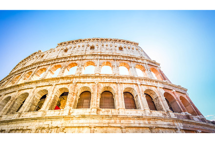 Colosseum at sunset in Rome, Italy, an Architecture Photo by Neirfy