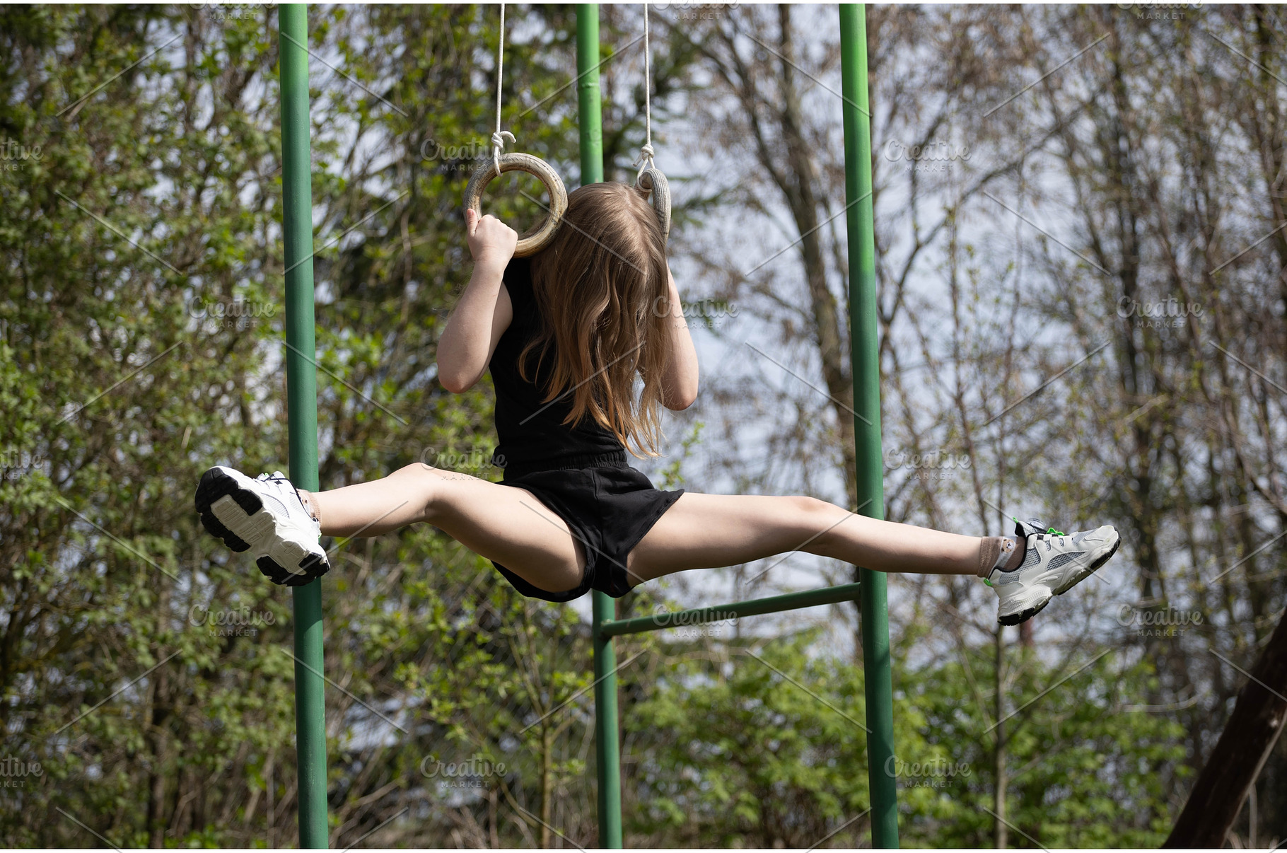 Cute girl doing rings gymnastics, a Sports & Recreation Photo by Nenahliadava Design