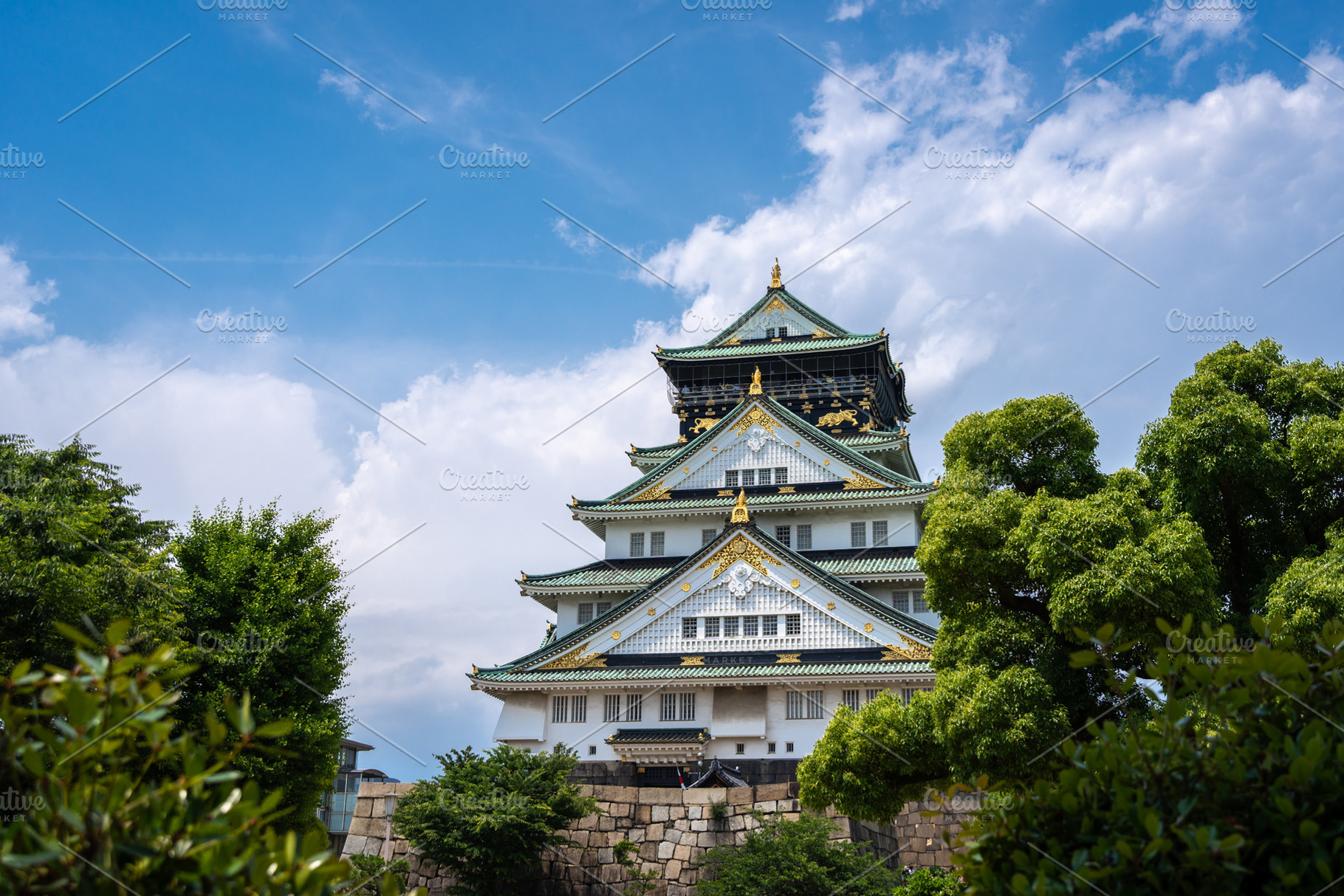 Main tower of Osaka Castle in Japan on sunny day, an Architecture Photo by GoodGoods