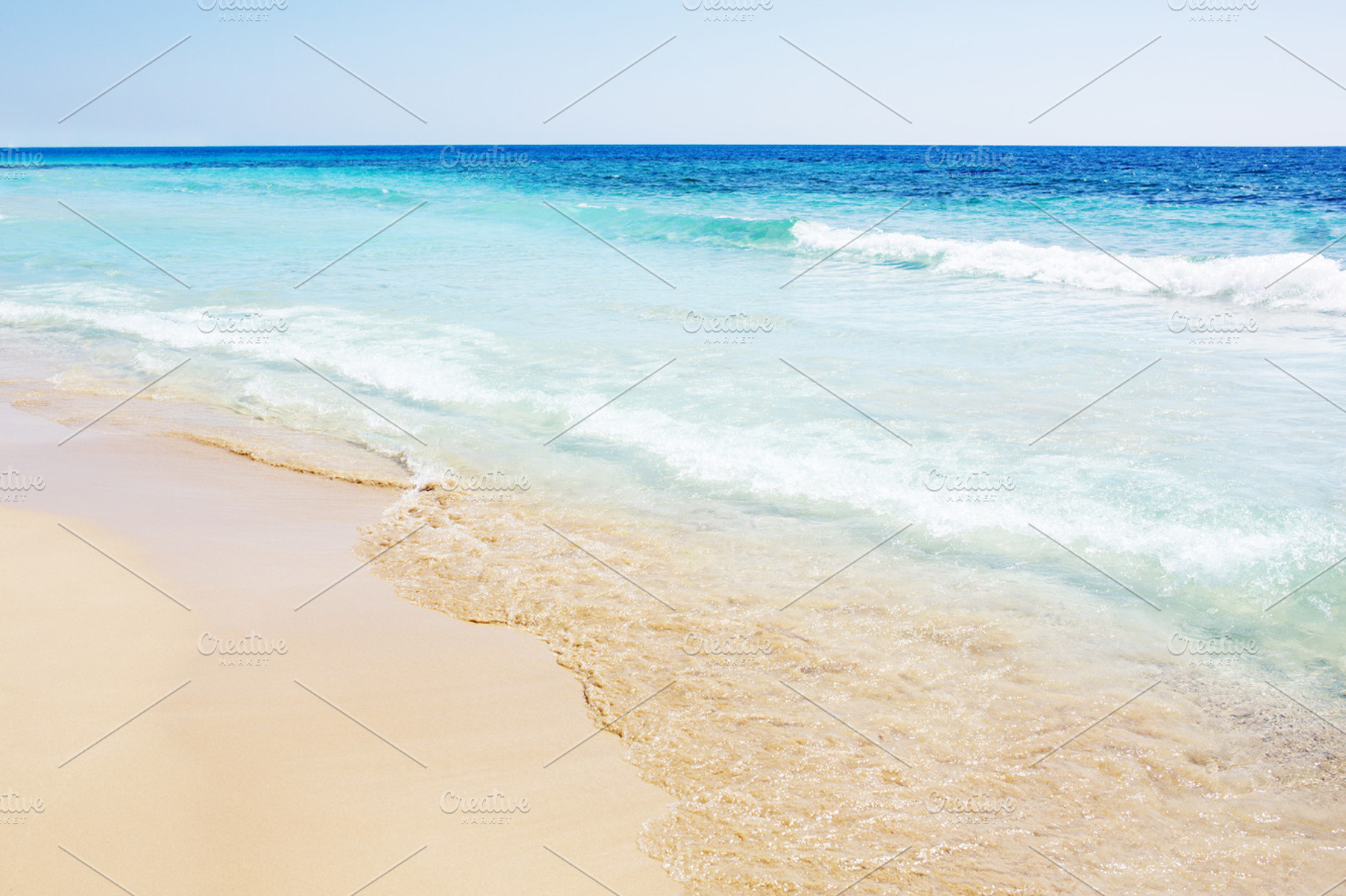 Sandy beach and a tropical sea waves, a Nature Photo by odpium