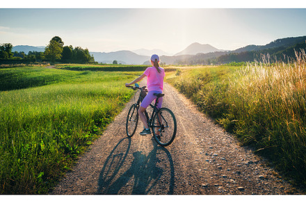 Woman on mountain bike on gravel, a Sports & Recreation Photo by den-belitsky