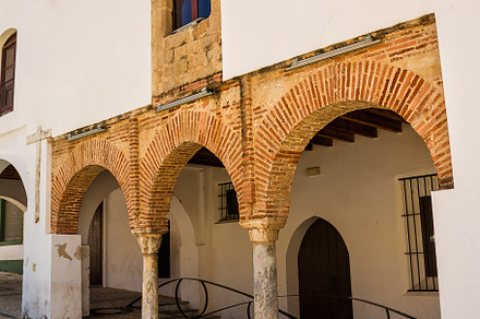 Facades of the Madejar Houses of the Center of Badajoz with arch, an Architecture Photo by Angelo D'Amico Photograph