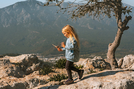 Child hiking in mountains travel vacations adventure outdoor healthy lifestyle, a Person Photo by e v e r s t