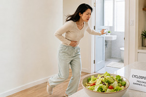 Asian woman experiencing stomach pai, a Photo by Dvoevnore photos