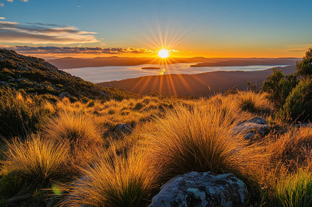 Stunning sunset over the Tasmanian l, a Photo by Iftikhar Alam