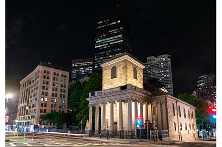 King's Chapel glowing at night amid