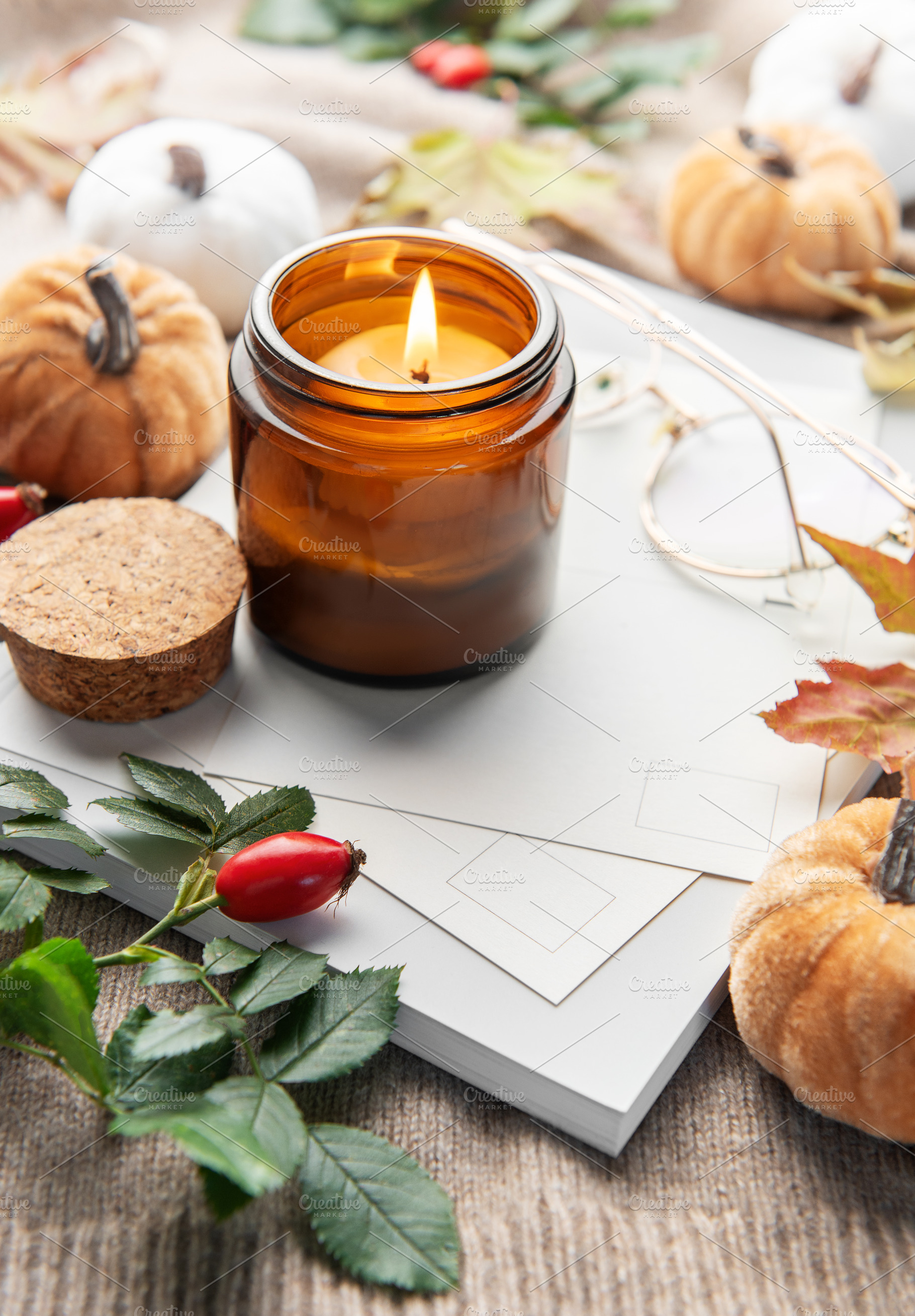 Lit candle creating cozy autumn hygge mood, a Holiday Photo by Olena Rudo