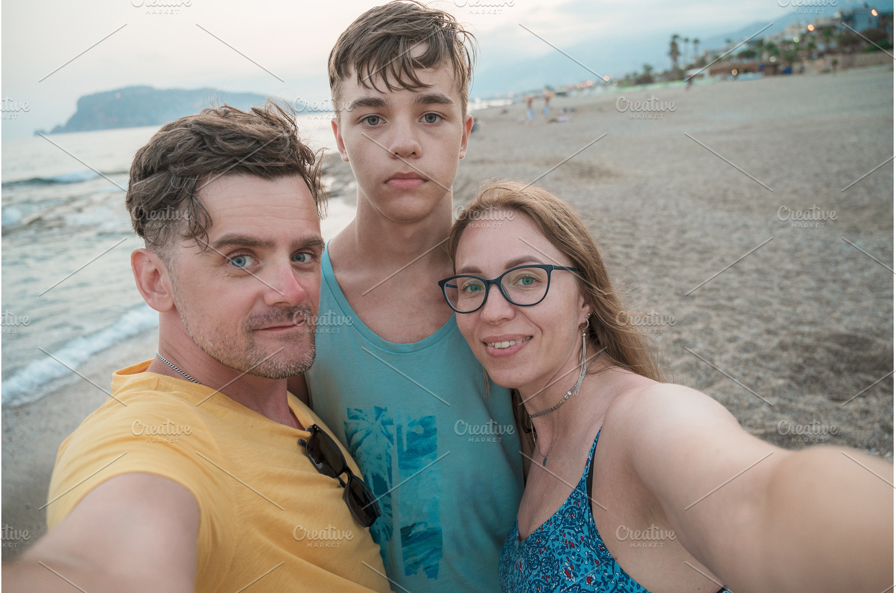 Happy family taking a photo, a Person Photo by Jan Jack Russo Media