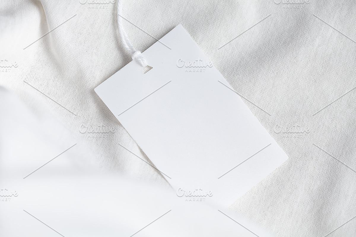 Clothes label tag blank white mockup, an Advertising Mockup by Olha Klein (Photo 2 of 3)