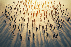 Crowd of silhouettes gathering under, a Photo by Tanuart
