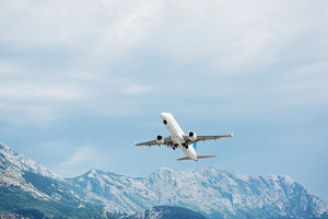 Airplane take off. Mountains view.