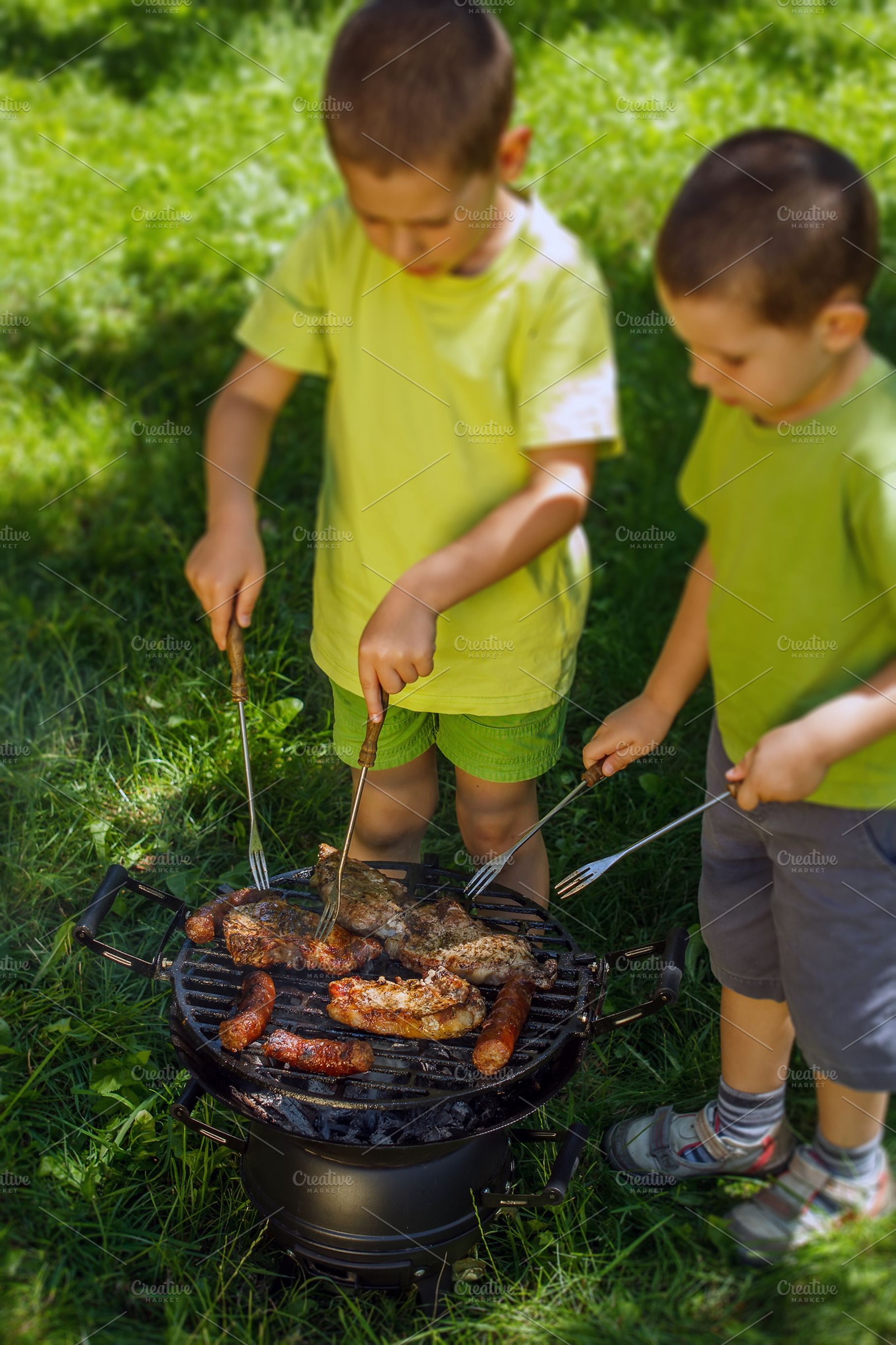 Barbecue party containing bbq, garden, and boys